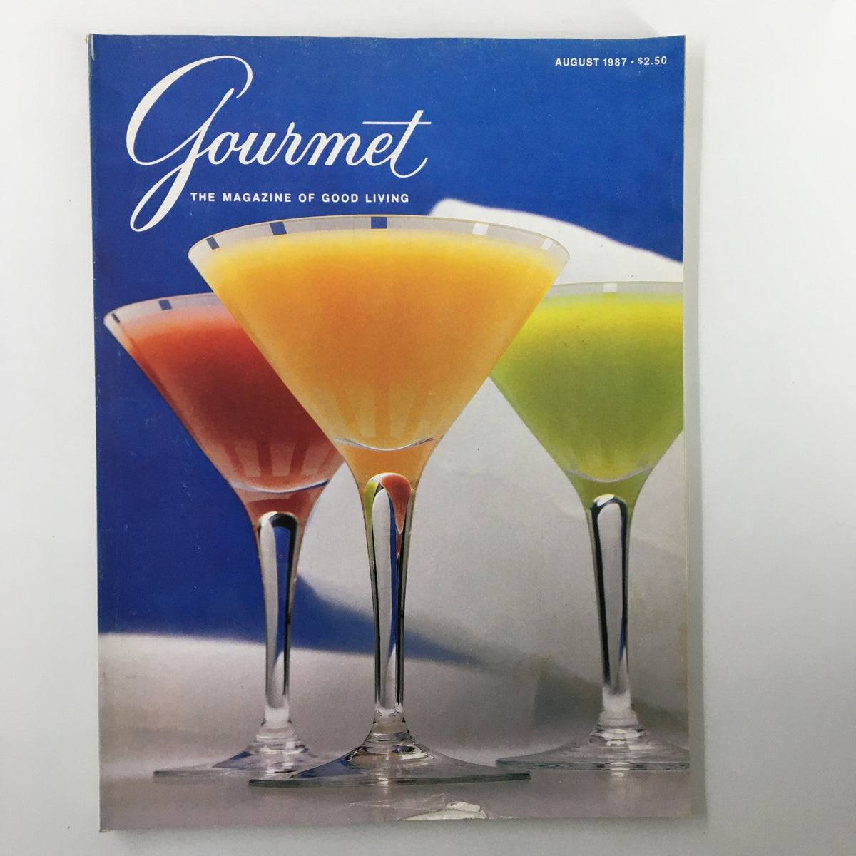 Vintage Gourmet Magazine August 1987 cover featuring colorful cocktails in elegant glasses, highlighting gourmet cooking and culinary artistry.