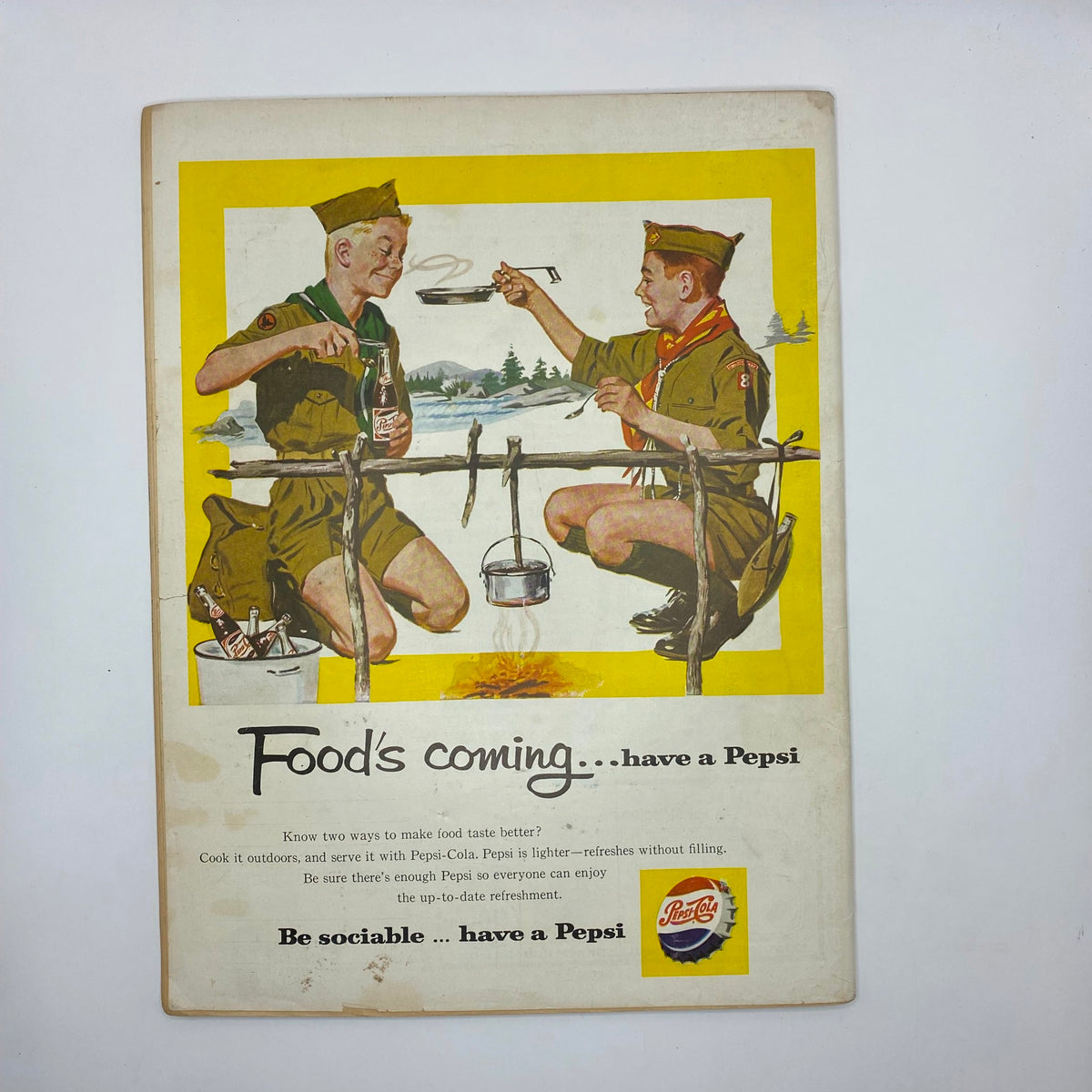 Back cover of Boys' Life for All Boys Magazine October 1959 promoting Pepsi-Cola with an illustration of two scout boys enjoying a drink, highlighting social camaraderie and outdoor fun.