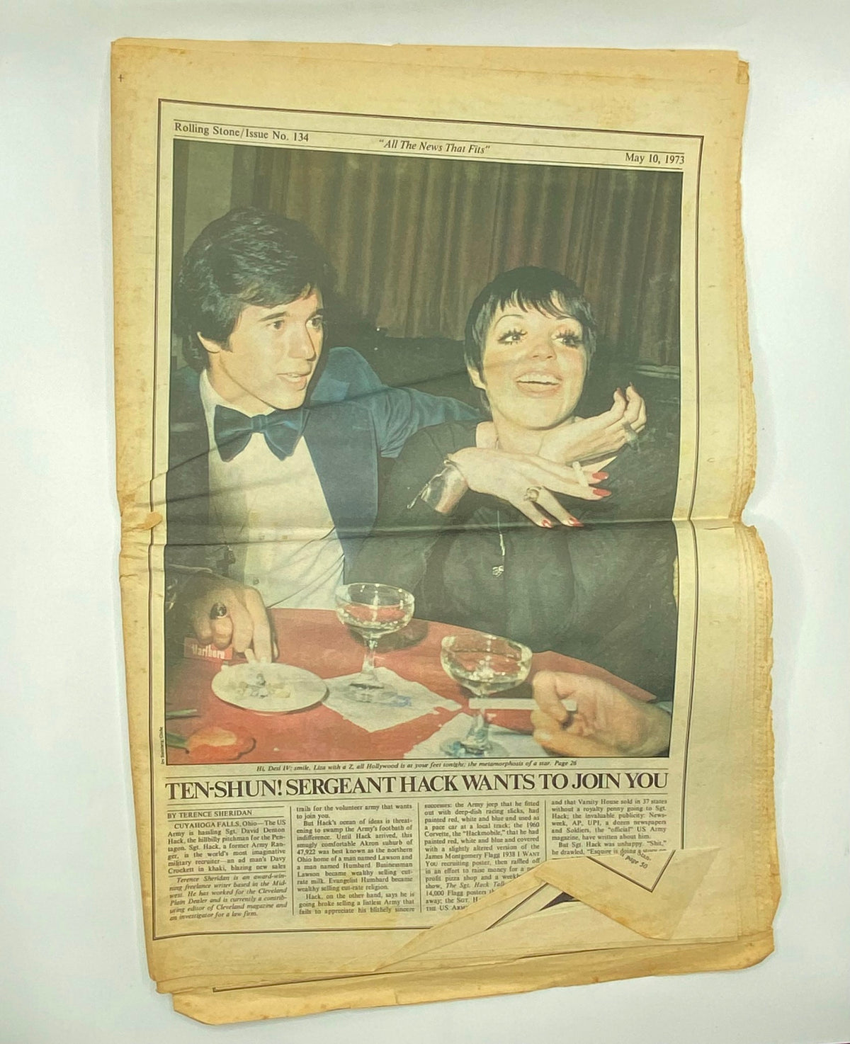 Inside spread of Rolling Stone Magazine May 10, 1973 Issue No. 134, showcasing a glamorous photo of Liza Minnelli and another individual dining, reflecting the social scene of the era.