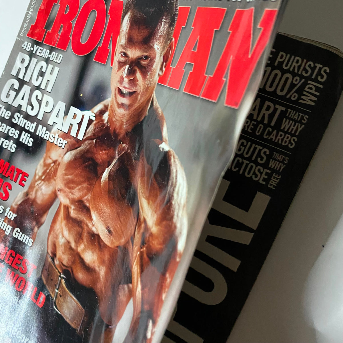 Close-up of Iron Man Magazine October 2011, highlighting Rich Gaspart's muscular physique, is a collectible vintage magazine.