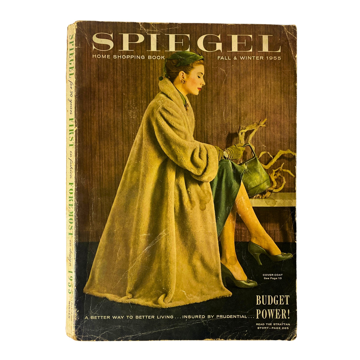 Cover of the 1955 Spiegel Fall and Winter Catalog featuring a woman in a stylish coat, representing mid-century fashion and home shopping.