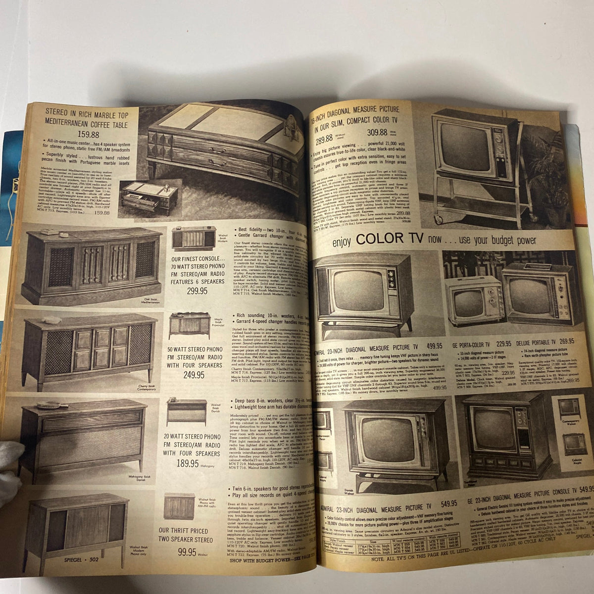 Products from the 1968 Spiegel Spring and Summer Catalog highlighting various audio equipment like stereos, radios, and color TVs in a retro style.