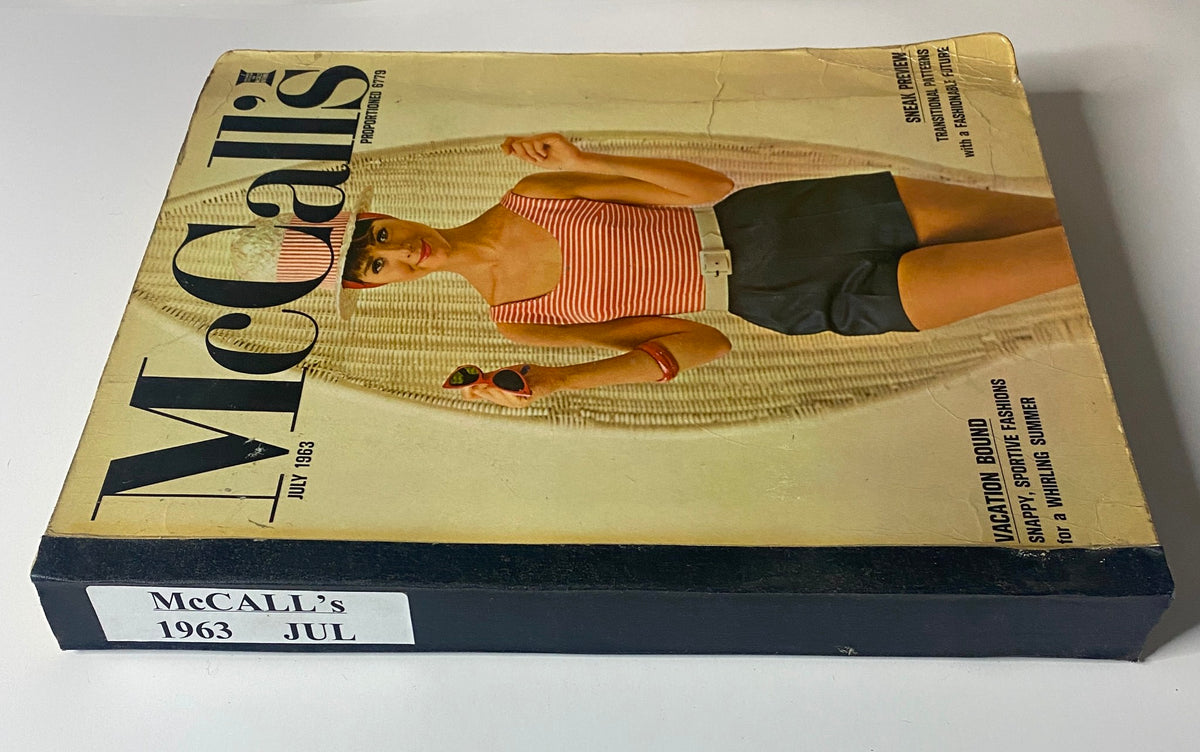 Spine and side view of the 1963 July McCall's Summerwear Catalog, displaying its title, date, and a model in summer attire on the front cover.
