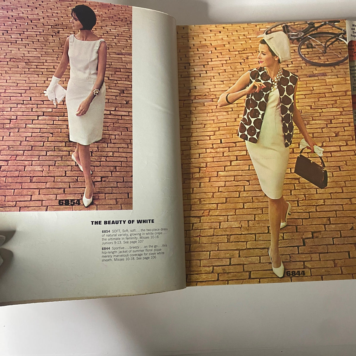 1963 July McCall's Summerwear Catalog showcasing elegant summer fashion, featuring a model in a white dress alongside another model in a stylish patterned vest.