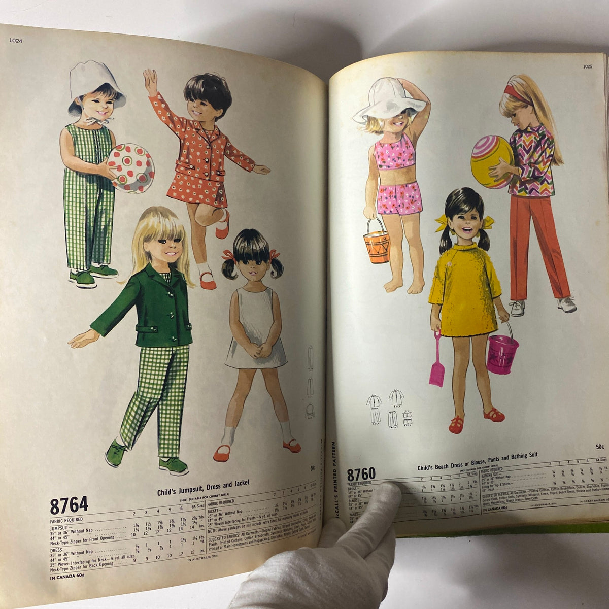 1967 May McCall's New York Designers' Collection featuring children's clothing patterns including jumpsuits, dresses, and beach wear, illustrated with vibrant images of children in various outfits.