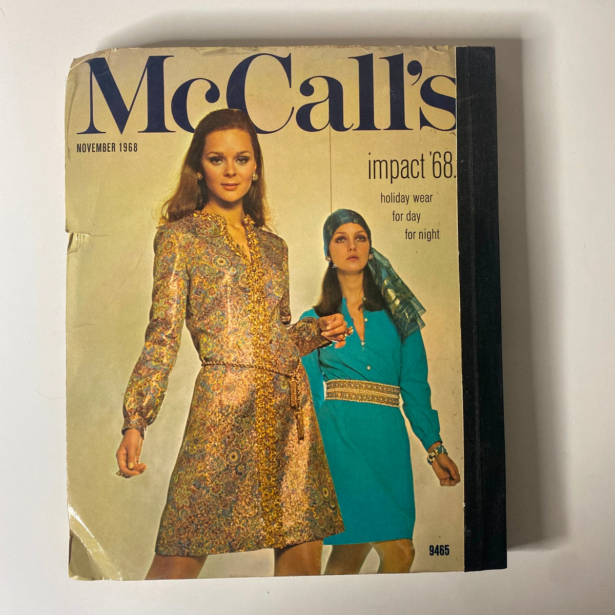 Cover of the 1968 November McCall's Holiday Wear Catalog, featuring models in fashionable holiday attire, ideal for parties and celebrations.