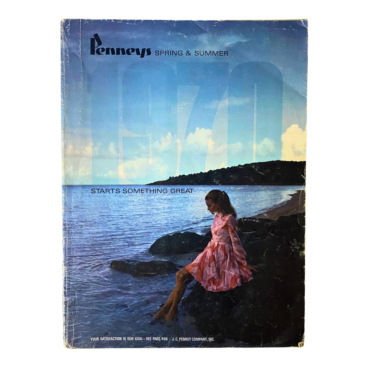 Cover of the 1970 JC Penneys Spring and Summer Store Catalog featuring a woman in a pink dress sitting by the water with the title and tagline prominently displayed.