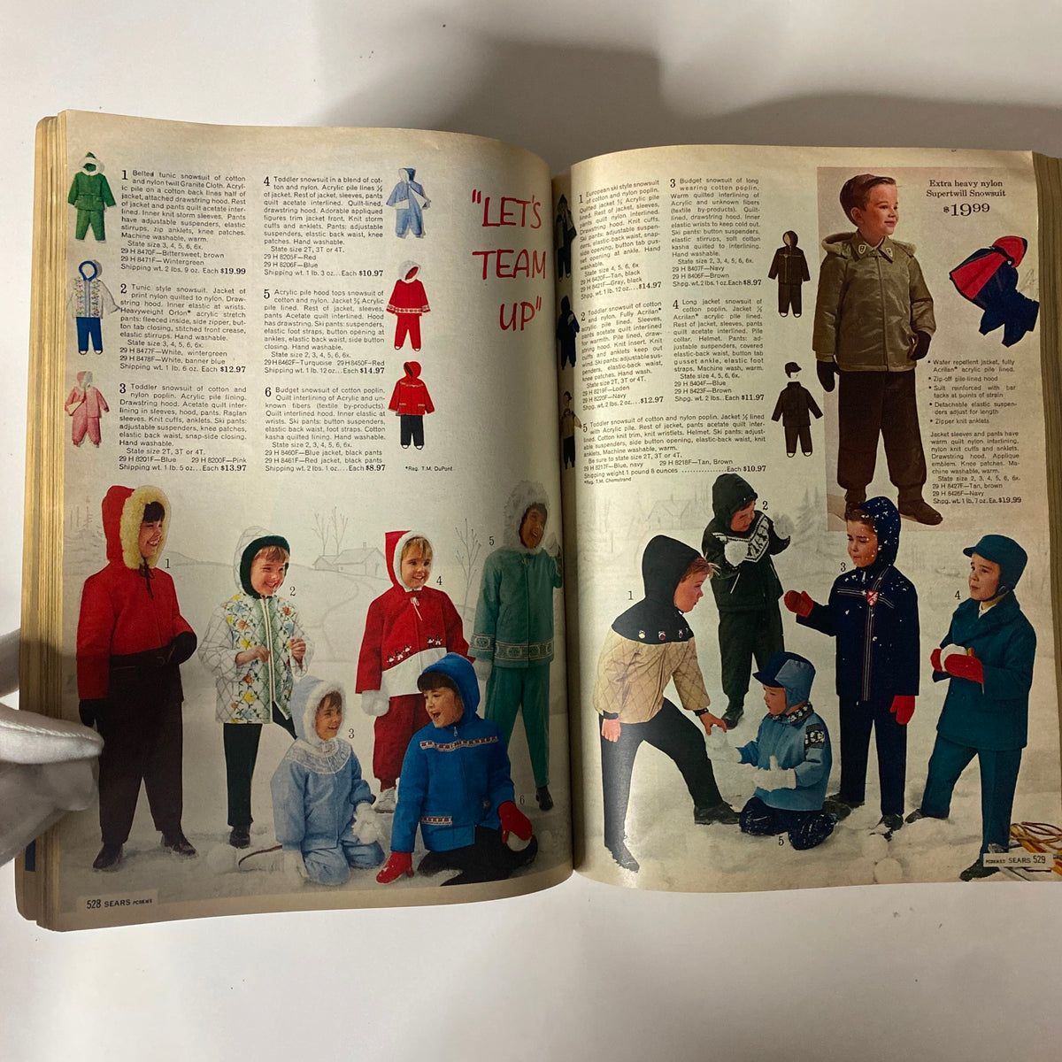 1970 Sears Fall and Winter Catalog displaying children's winter apparel with vibrant coats and snowsuits, highlighting trendy designs for kids.
