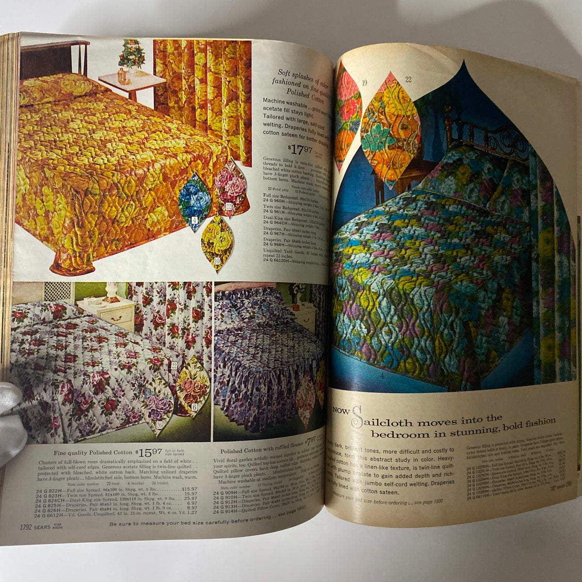 1965 Sears Fall and Winter Catalog showcasing colorful bedspreads and draped fabrics in a vintage bedroom setting, highlighting seasonal home décor options.