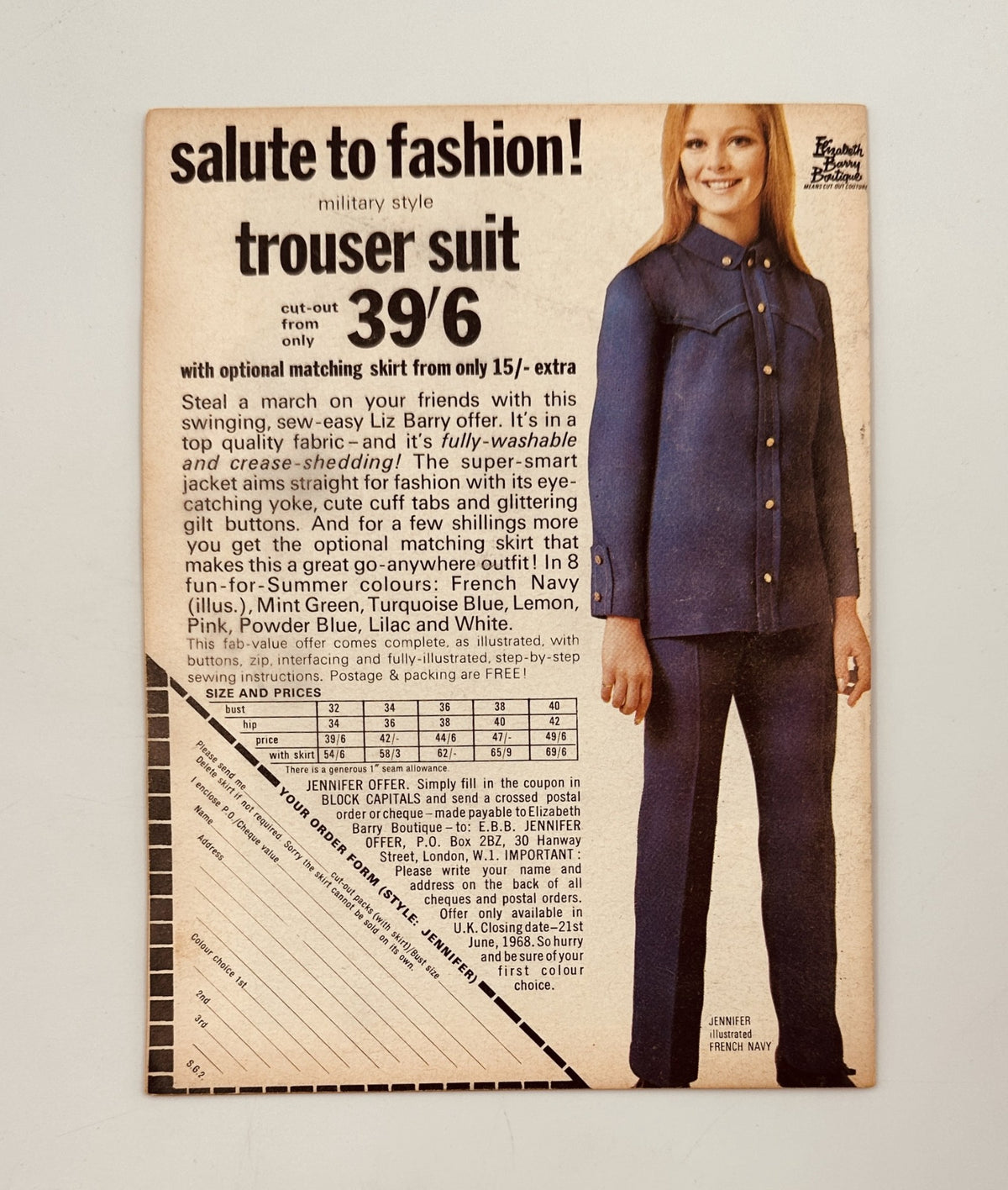 Advertisement for a military style trouser suit from Liz Barry in the May 1968 issue of Showguide Magazine, featuring details on available colors and fashion styling.