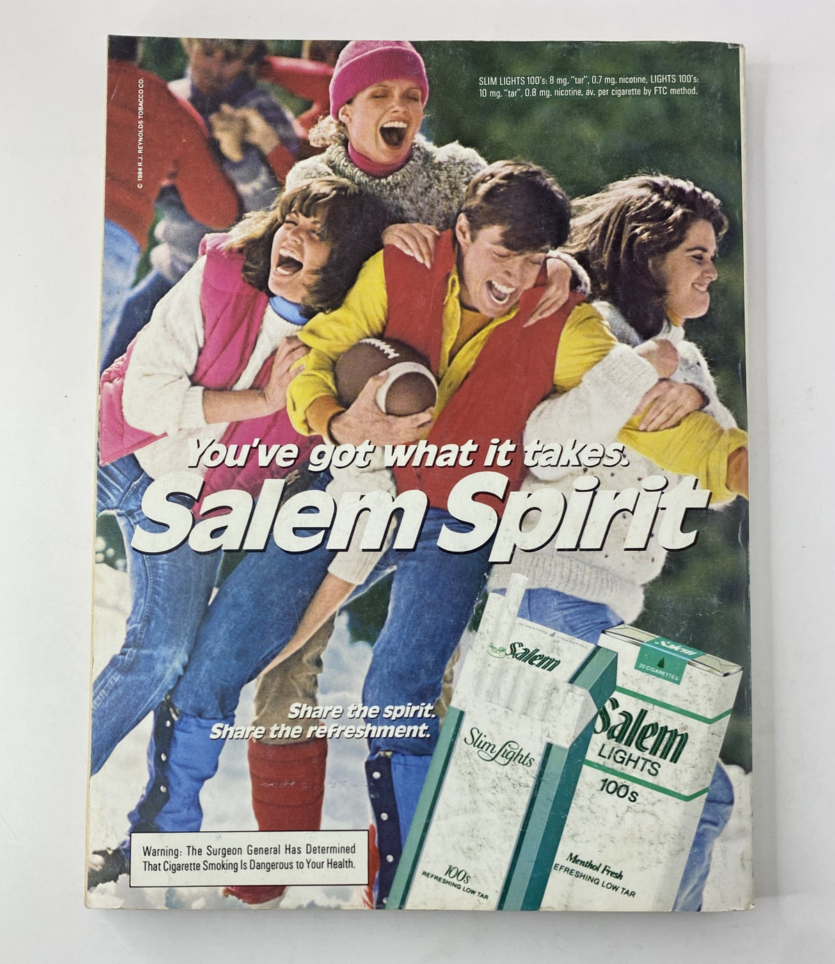 Vintage Salem advertising featuring excited individuals enjoying outdoor fun, showcasing the slogan 'You've got what it takes. Salem Spirit. Share the spirit. Share the refreshment.' from Cosmopolitan Magazine March 1985 Renee Simonsen.