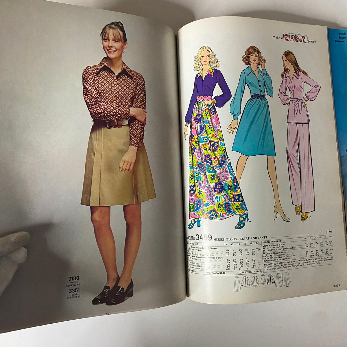 1972 McCall's Holiday Huge Store Retail Counter Catalog showcasing models in vintage holiday fashion, including a plaid blouse and a pleated skirt outfit.