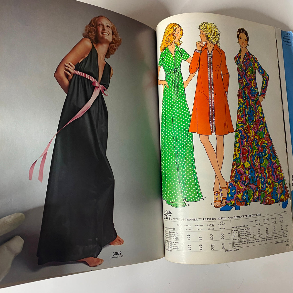 1972 McCall's Holiday Huge Store Retail Counter Catalog illustrating a model in a long evening gown with a pink sash alongside colorful patterned dresses, capturing 70s style.