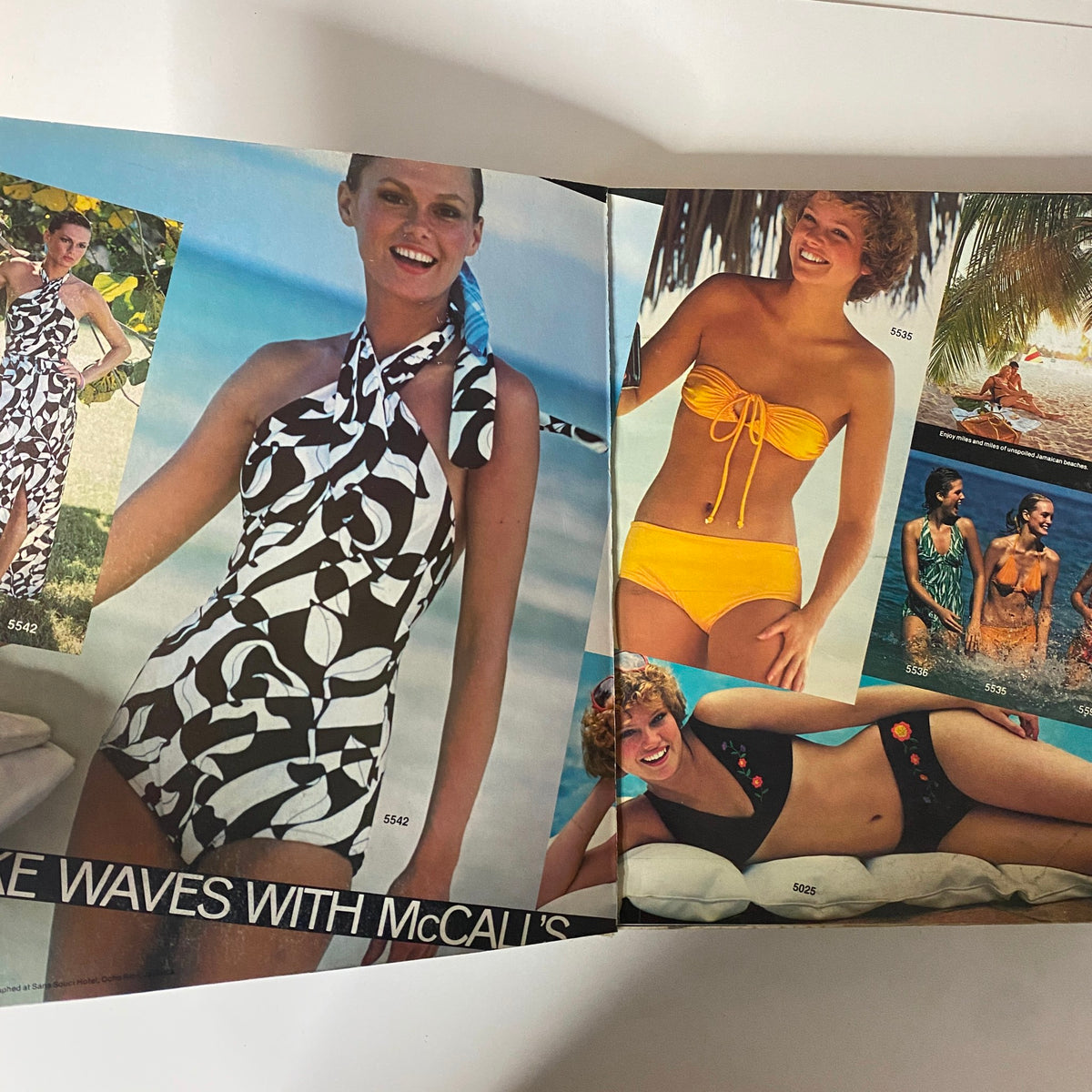 Page spread in the 1977 July Carefree Patterns McCall's Summer Catalog displaying various swimwear styles, highlighting creative pattern options for summer sewing projects.