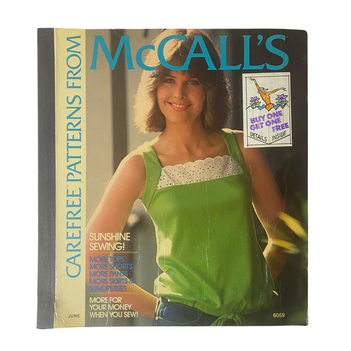 1970s June Carefree Patterns McCall's Huge Store Retail Counter Catalog cover featuring a model in a vibrant green top, showcasing summer sewing themes and fashion.