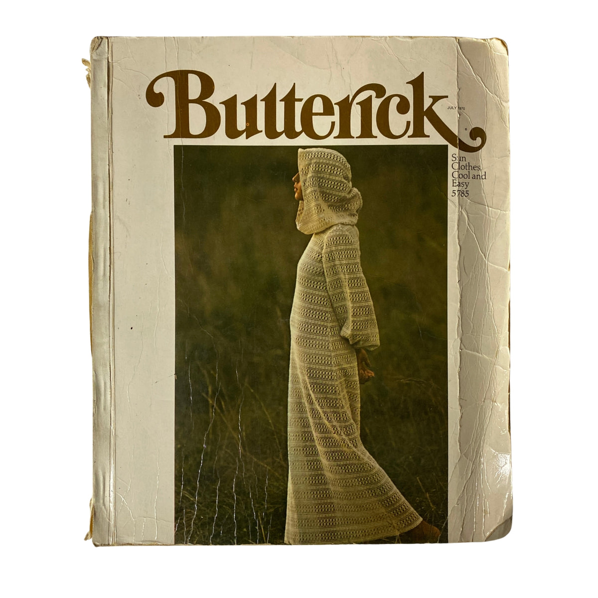 Cover of the 1970 July Butterick Catalog showcasing a model in a knit dress. This vintage catalog highlights sewing patterns for misses and juniors.