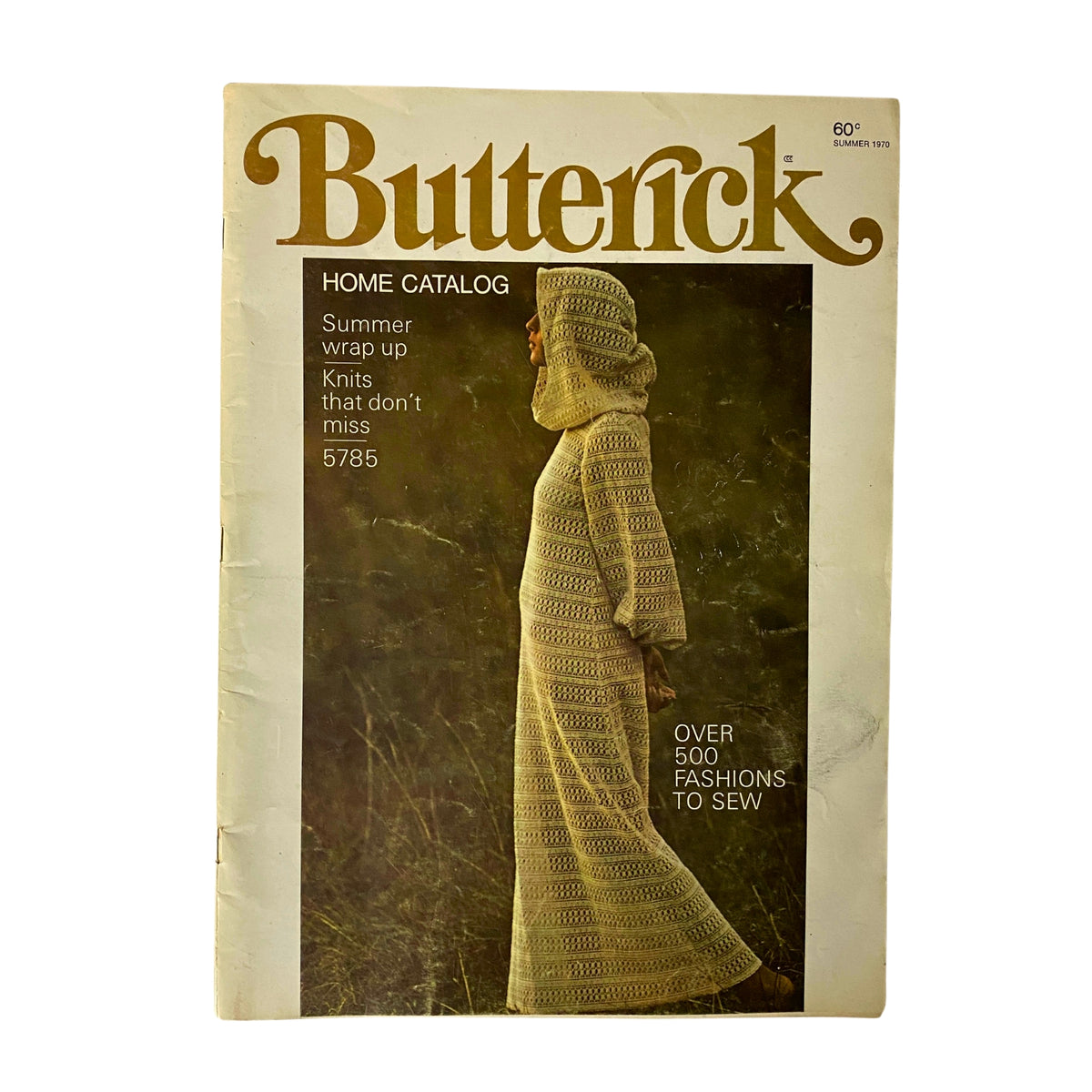 1970 Butterick Summer Home Catalog featuring a model in a stylish knitted dress, showcasing summer fashion patterns for home sewing. The catalog highlights over 500 fashionable designs, perfect for vintage sewing enthusiasts.
