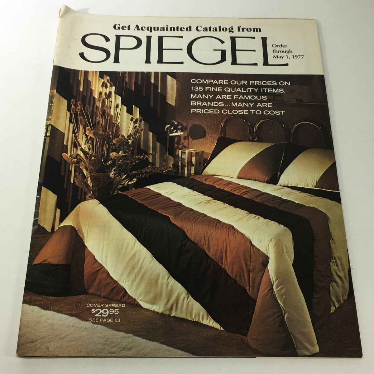 VTG Spiegel Store Catalog from May 1977 showcasing a decorative cover design with bold striped bedding and home decor items.