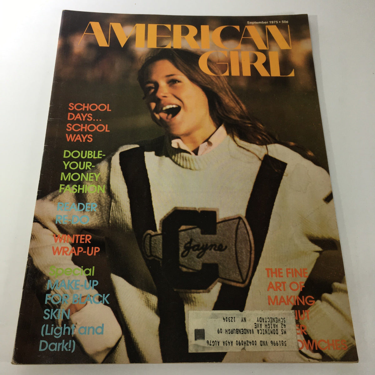 VTG American Girl Magazine: September 1975 showcasing a girl in a sweater with bold text highlights including 'Double-Your-Money Fashion' and 'School Days... School Ways' on the cover.