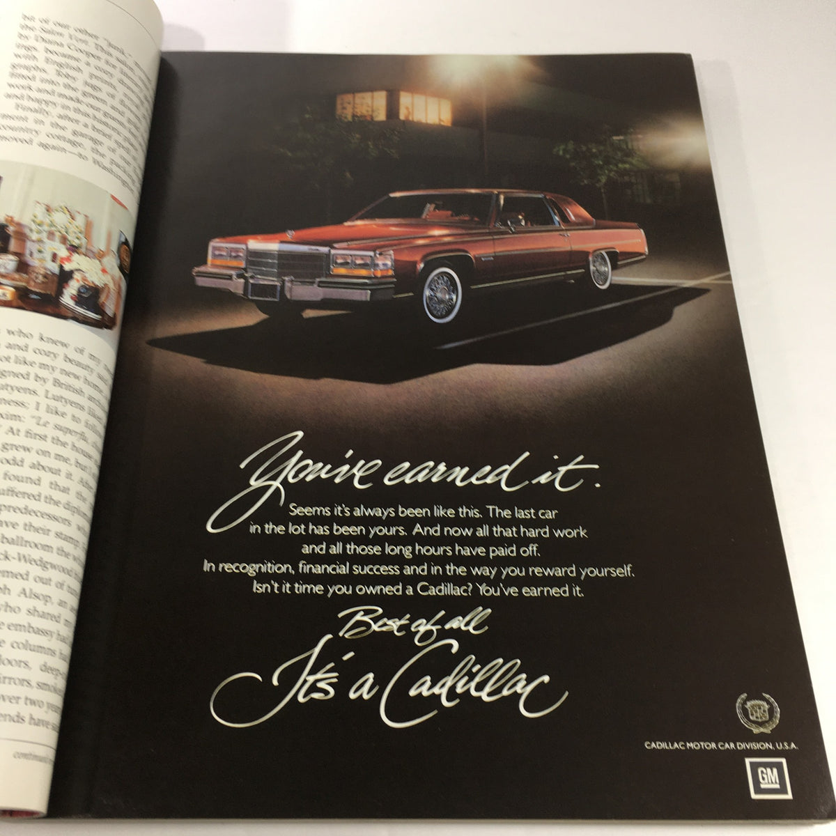 Inside page of VTG Architectural Digest For Art's Sake Catalog: June 1982, showcasing a vintage Cadillac advertisement emphasizing luxury and achievement.