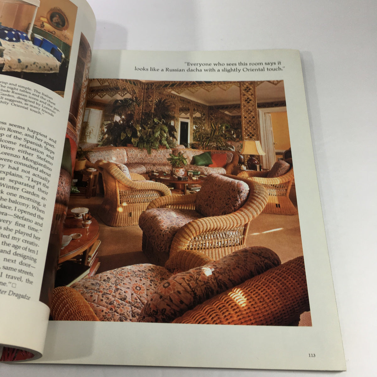 Inside page of VTG Architectural Digest For Art's Sake Catalog: June 1982, displaying an opulent interior featuring wicker chairs and floral patterns in a stylish room.