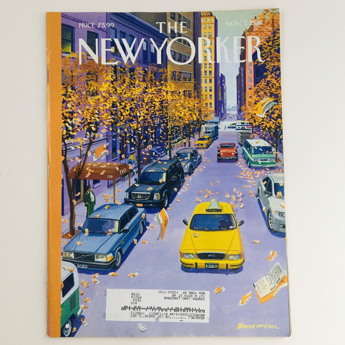 Cover of The New Yorker November 7, 2011, featuring a vibrant urban scene with autumn leaves and various cars, illustrated by Bruce McCall.