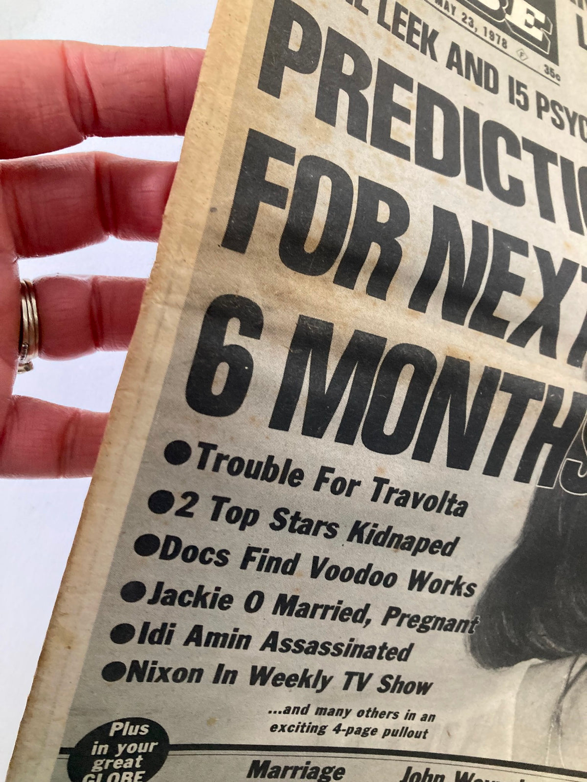 Close-up of the May 23, 1978 edition of Midnight Globe Tabloid, featuring headlines like 'Trouble For Travolta', '2 Top Stars Kidnapped' and details related to Hollywood news.