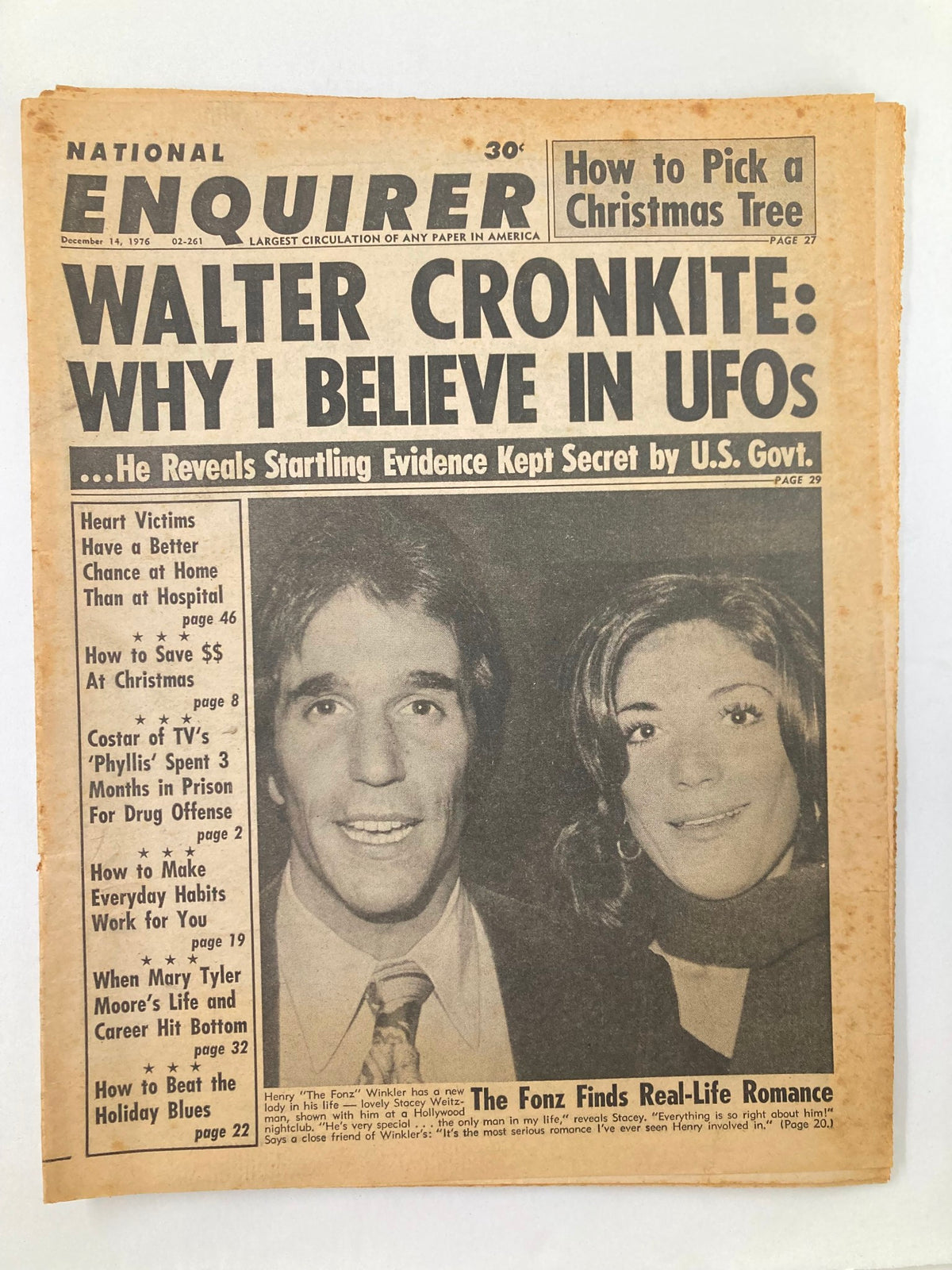 National Enquirer Tabloid December 14 1976 featuring Walter Cronkite discussing UFOs and an article with Henry Winkler and Stacey Weitzman alongside a photo of the couple.