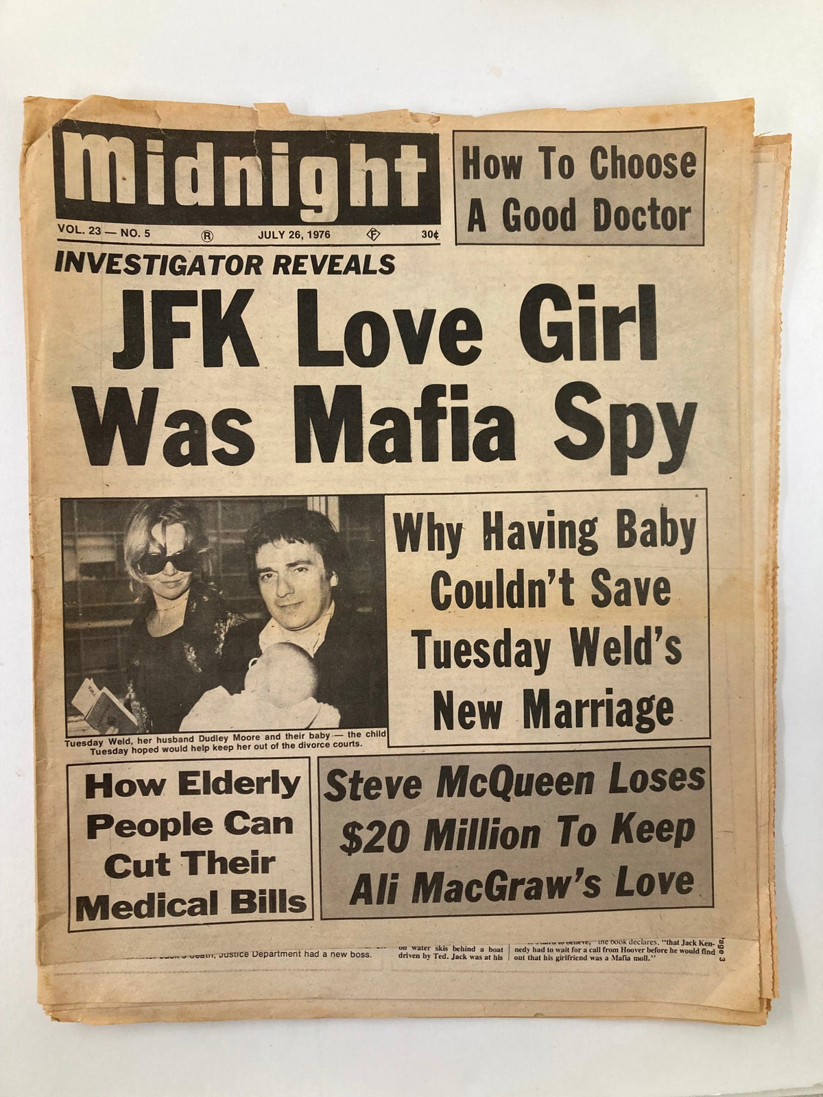 Midnight Tabloid July 26 1976 Vol 23 #5 featuring headlines about JFK love girl, Tuesday Weld, and Steve McQueen's financial struggles, showcasing a vintage look with yellowed pages.