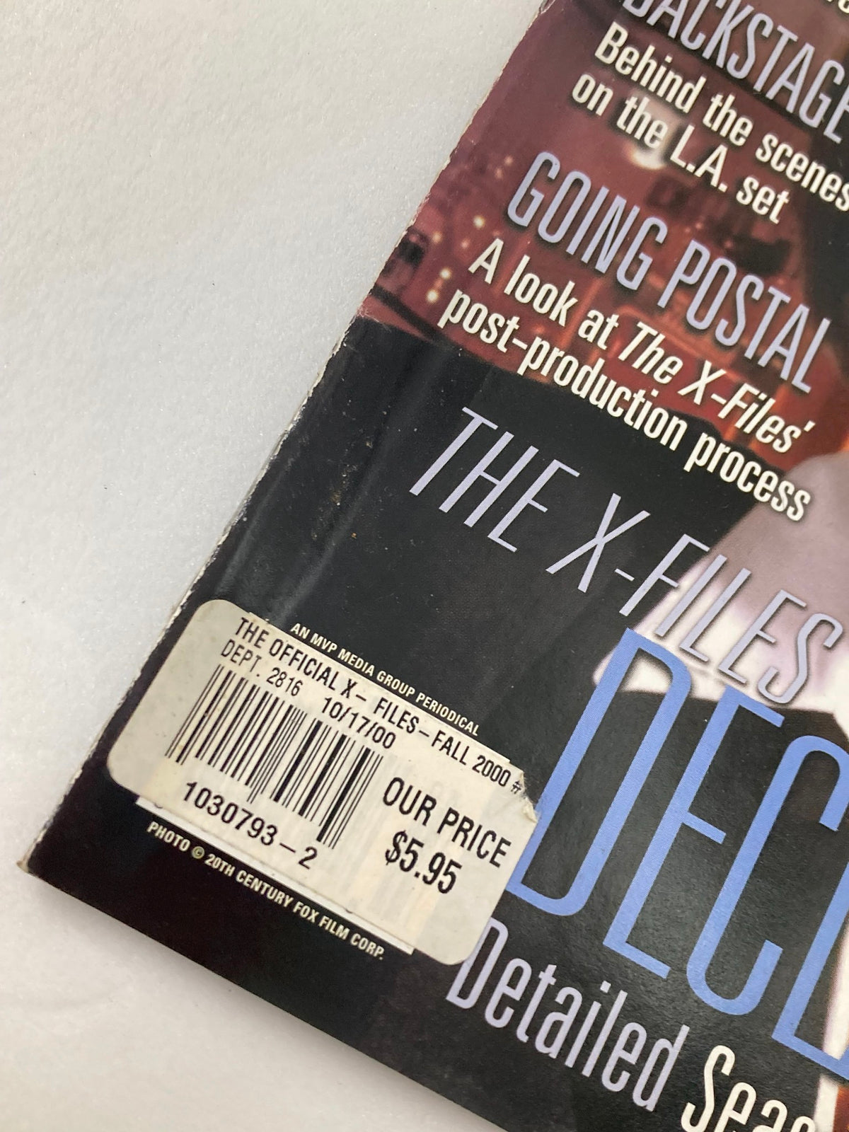 Close-up view of the price sticker on The X-Files Magazine, Fall 2000 showing a price of $5.95 and details of the magazine being an official periodical.