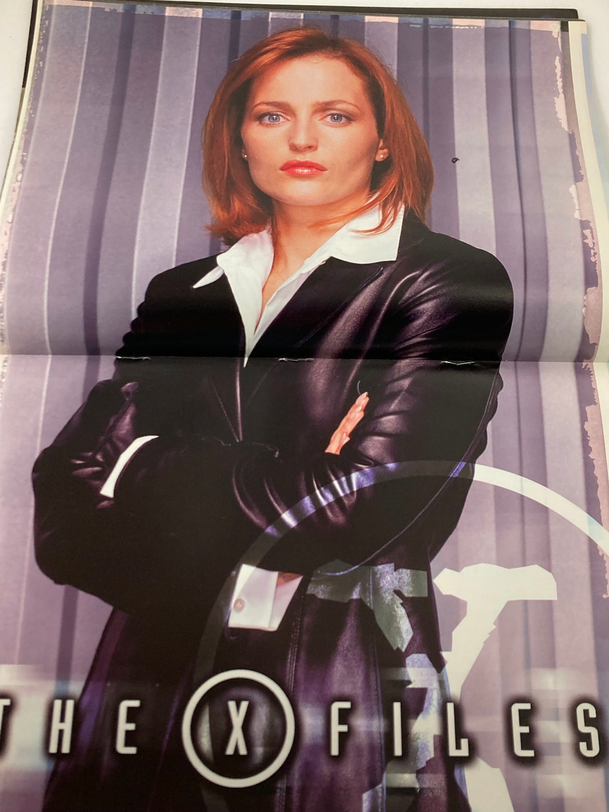Stunning image of Gillian Anderson in The X-Files Magazine April 2002 #2, showcasing her character in a stylish black coat.