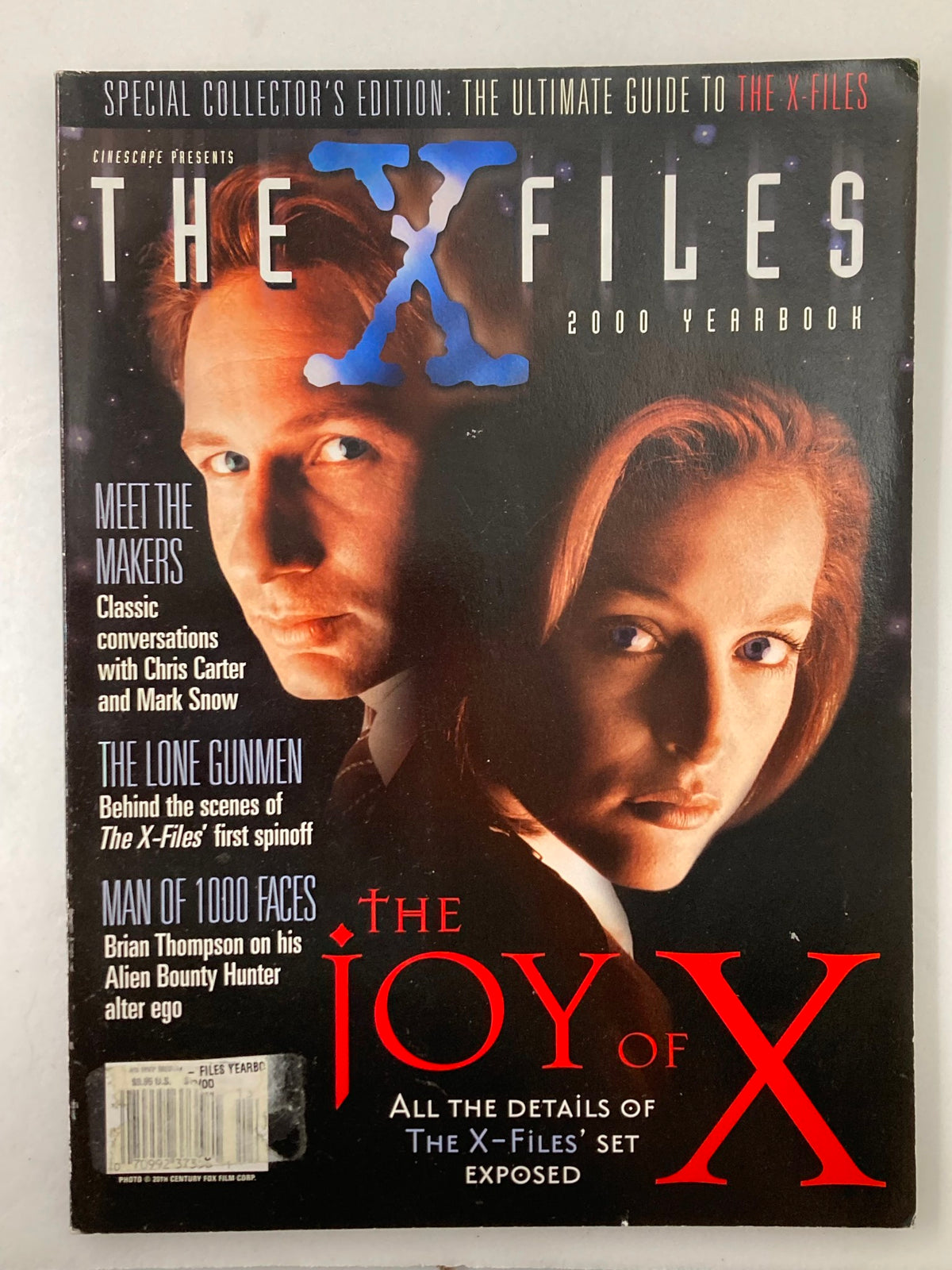 The X-Files Yearbook 2000 featuring David Duchovny and Gillian Anderson on the cover, showcasing iconic characters from the beloved sci-fi series.