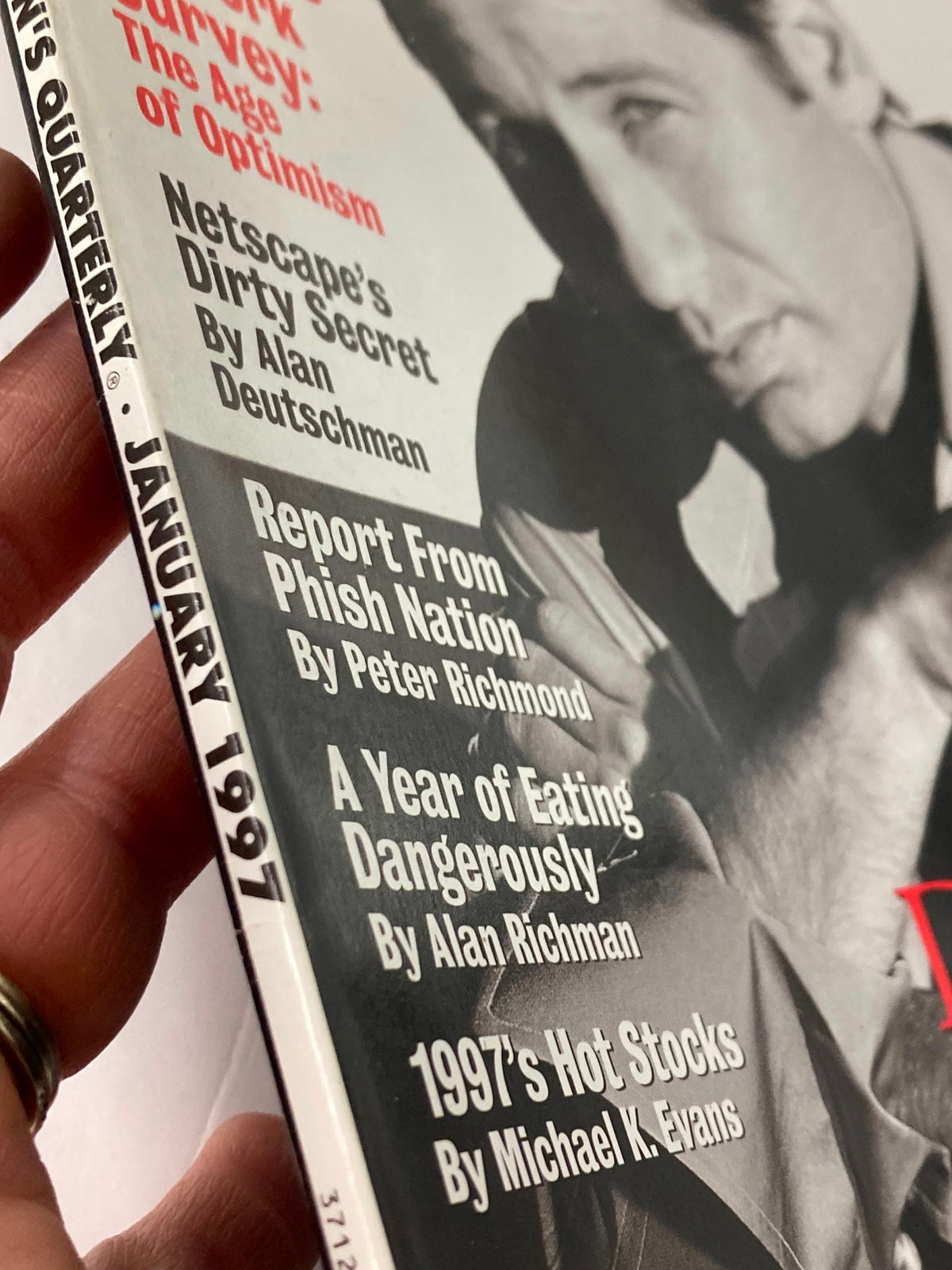 Close-up of the spine of GQ Magazine January 1997 highlighting articles and features alongside David Duchovny's X-cellent Adventure.