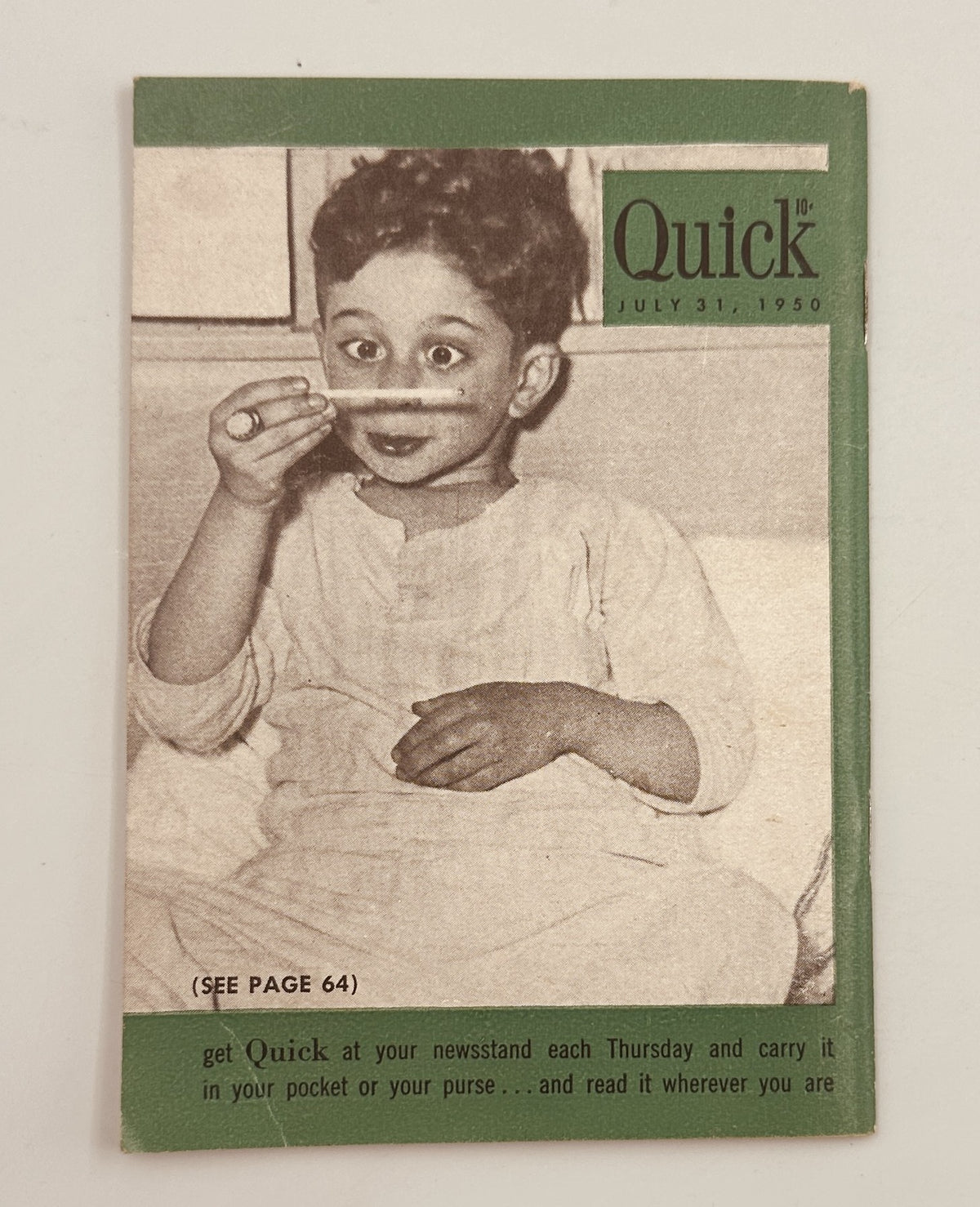 Back cover of Quick Magazine July 31, 1950, displaying an image of a young boy holding a pencil, promoting the magazine's weekly release.