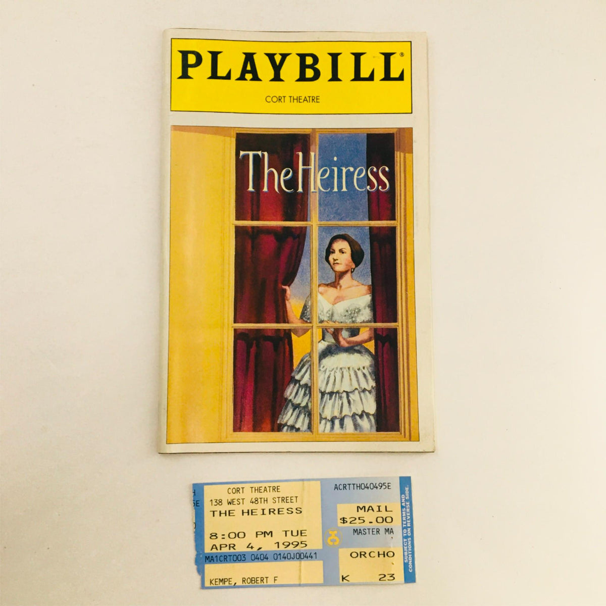 1995 Playbill The Heiress by Ruth and Augustus Goetz at Cort Theatre featuring an artistic cover with a woman in a window, accompanied by an original ticket for the performance.