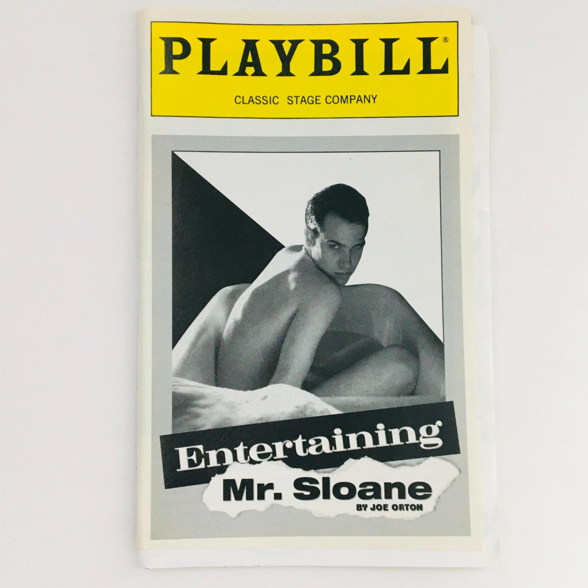 1996 Playbill for Entertaining Mr. Sloane by Joe Orton at Classic Stage Company, featuring a striking black and white photograph of a male model.