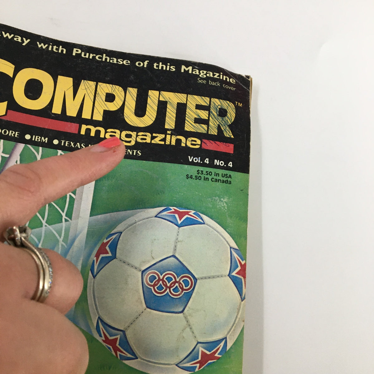 Close-up of the title 'Home Computer magazine' on Vol. 4 No. 4, emphasizing the vintage style and details of the magazine cover with Olympic soccer imagery.