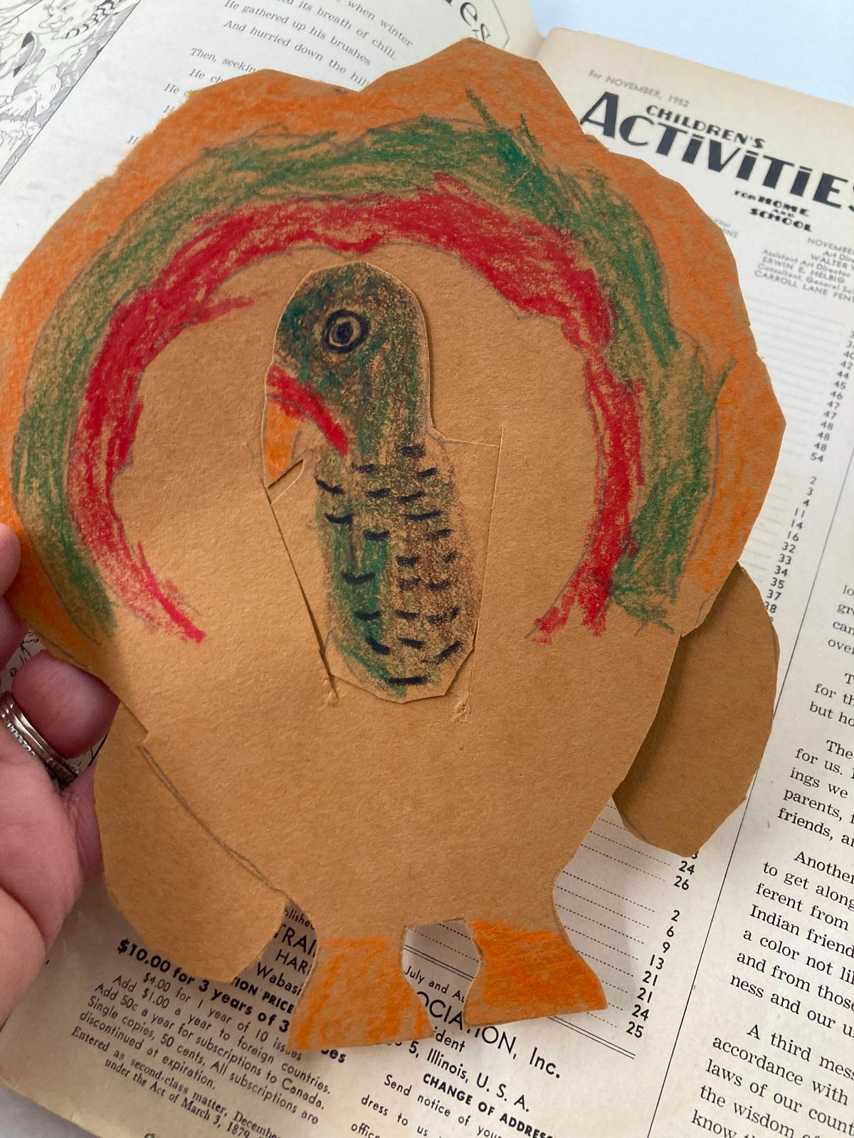 Child's handmade turkey art next to the VTG Children's Activities Magazine November 1952, illustrating a creative project inspired by the magazine's educational content.