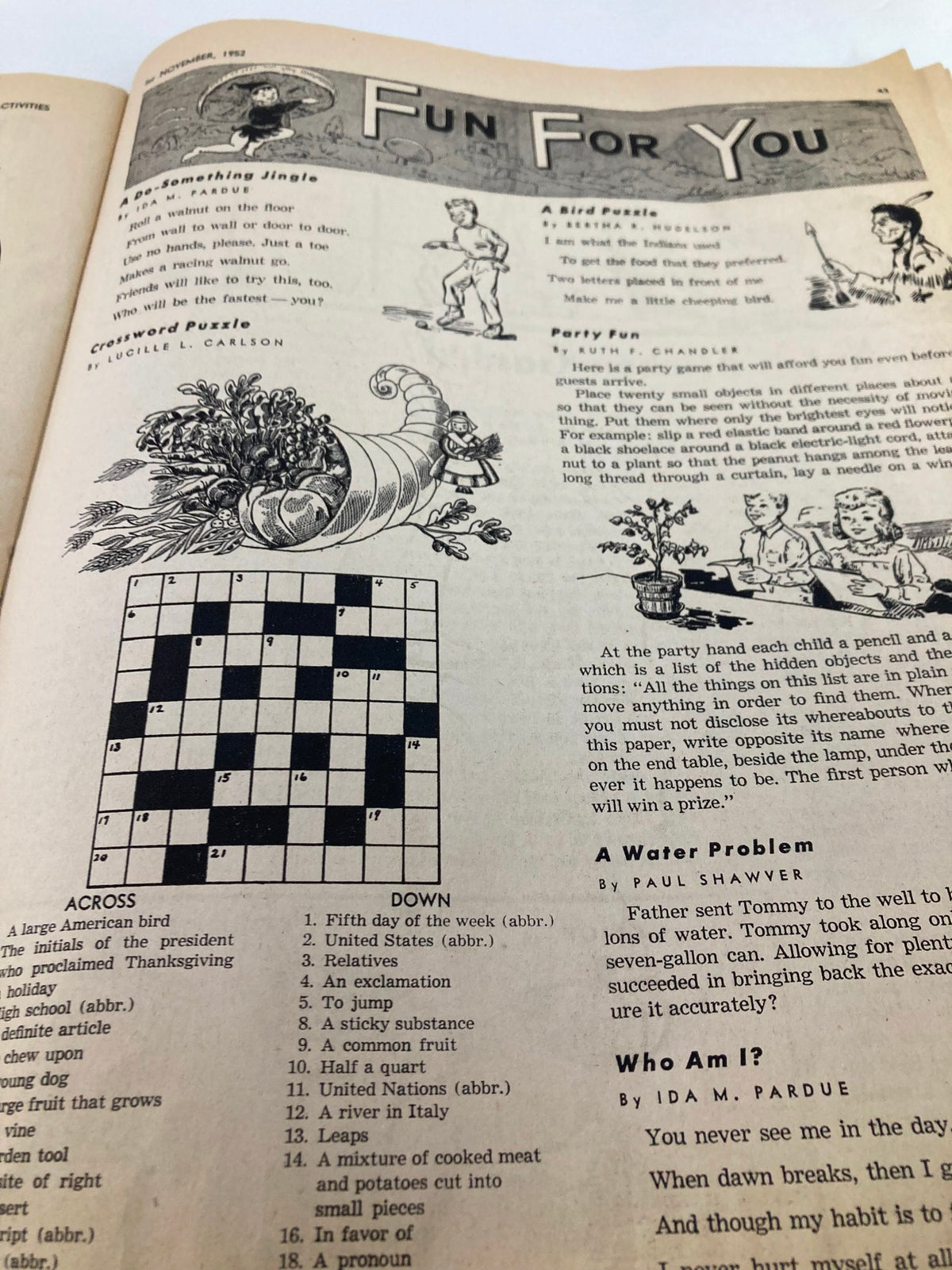 Image from 'Children's Activities Magazine' November 1952 displaying a crossword puzzle and various party fun activities for kids, encouraging engagement and entertainment.