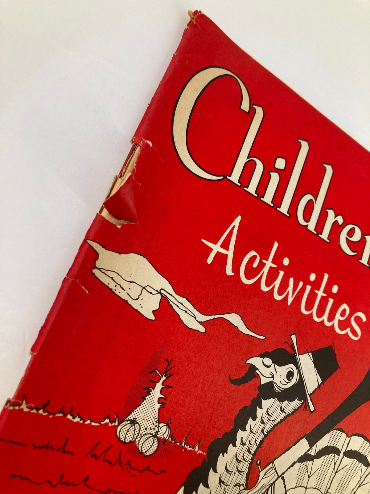 Close-up of the edge of the VTG Children's Activities Magazine, November 1959 showing wear and an address label on the cover.