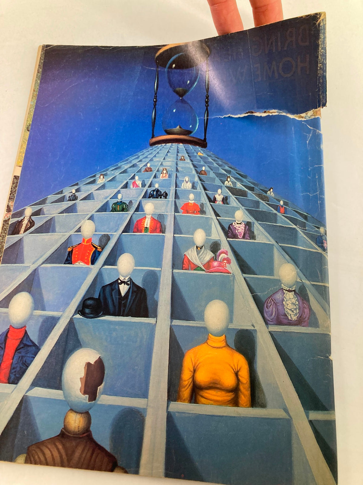 Back cover of VTG Heavy Metal Magazine October 1984 Vol 8 #7 depicting a surreal artwork with faceless figures representing a unique take on fantasy themes.