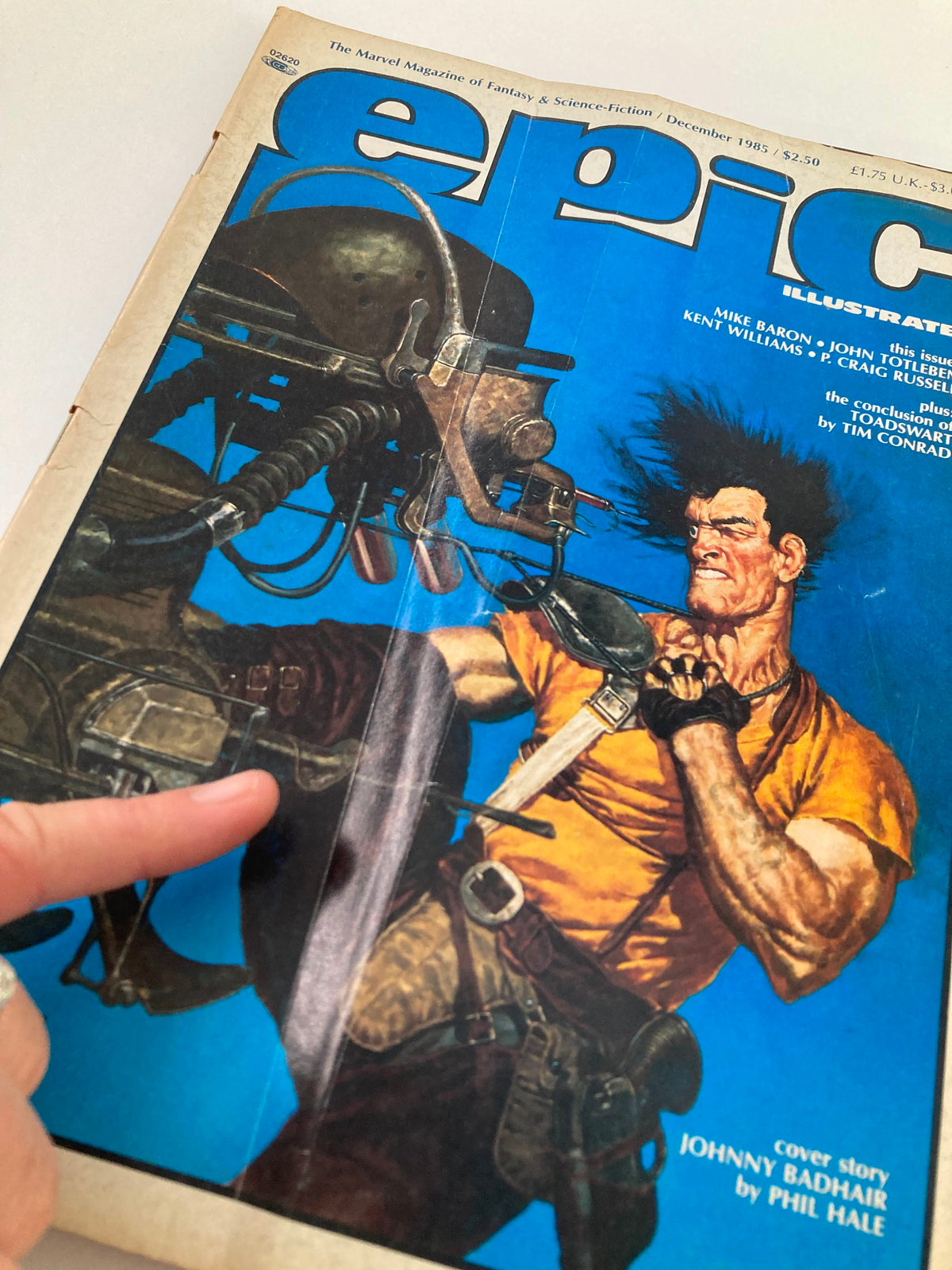 Close-up of the cover of VTG Epic Illustrated Magazine December 1985, highlighting Johnny Badhair's character drawn by Phil Hale. The image shows detailed facial expression and the magazine title in bold lettering.