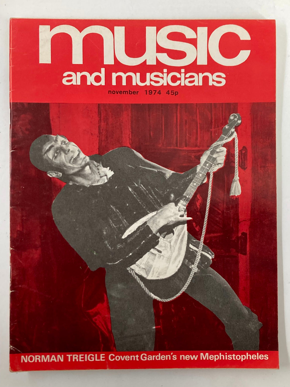 Cover of VTG Music & Musicians Magazine November 1974 #267 featuring Norman Treigle holding a guitar and performing, with a striking red background.