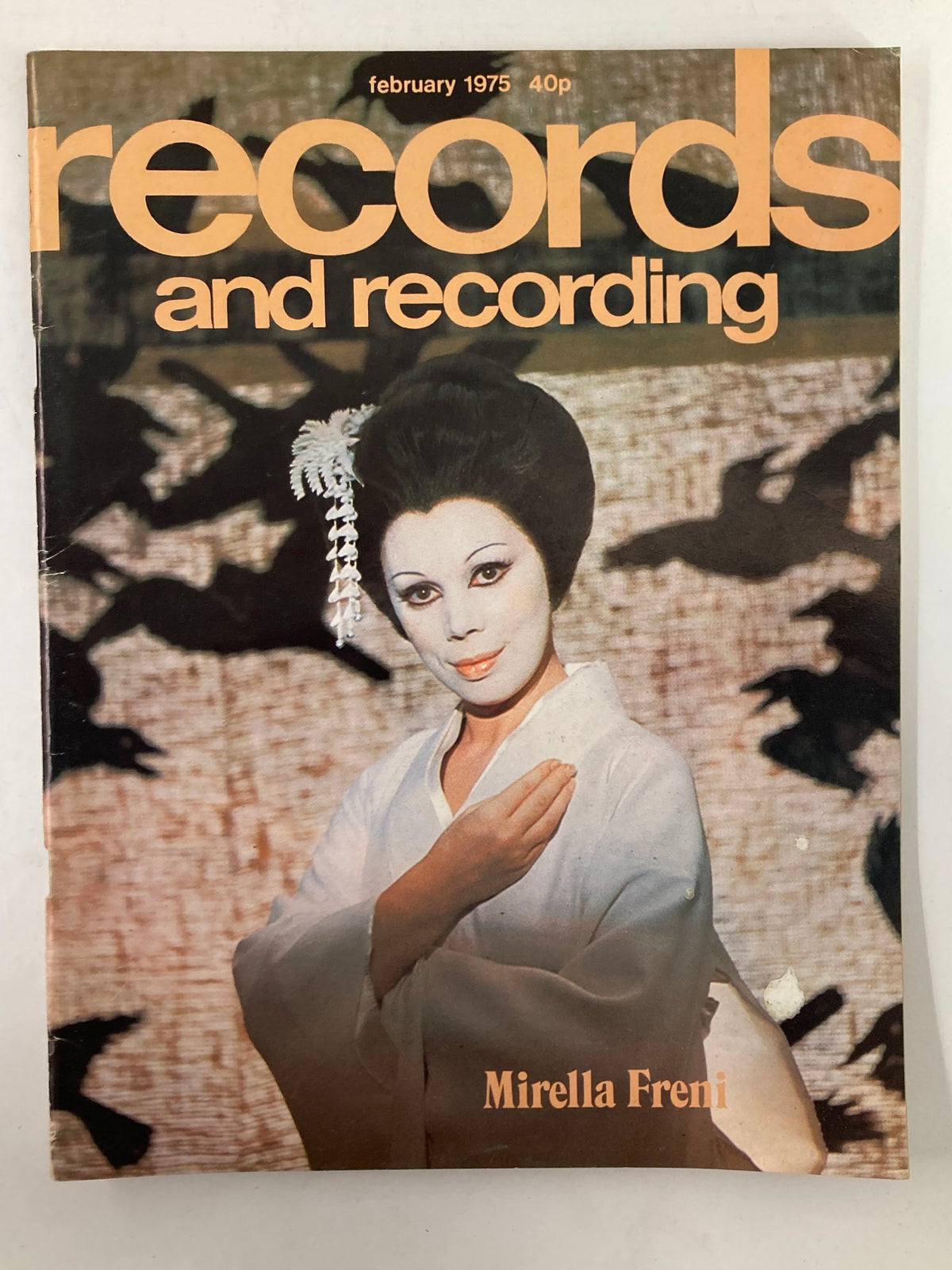 Cover of VTG Records & Recording Magazine from February 1975 featuring Mirella Freni, showcasing her in a traditional attire with a striking hairstyle and makeup, set against a patterned background.