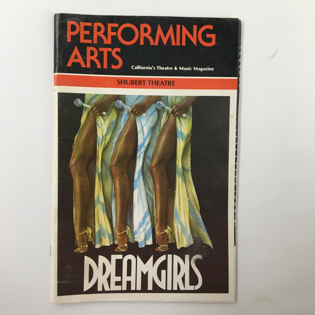 Performing Arts magazine cover featuring Dreamgirls by Michael Bennett, showcasing the Shubert Theatre. The cover highlights the iconic design with vibrant colors and a focus on legs wearing elegant dresses.