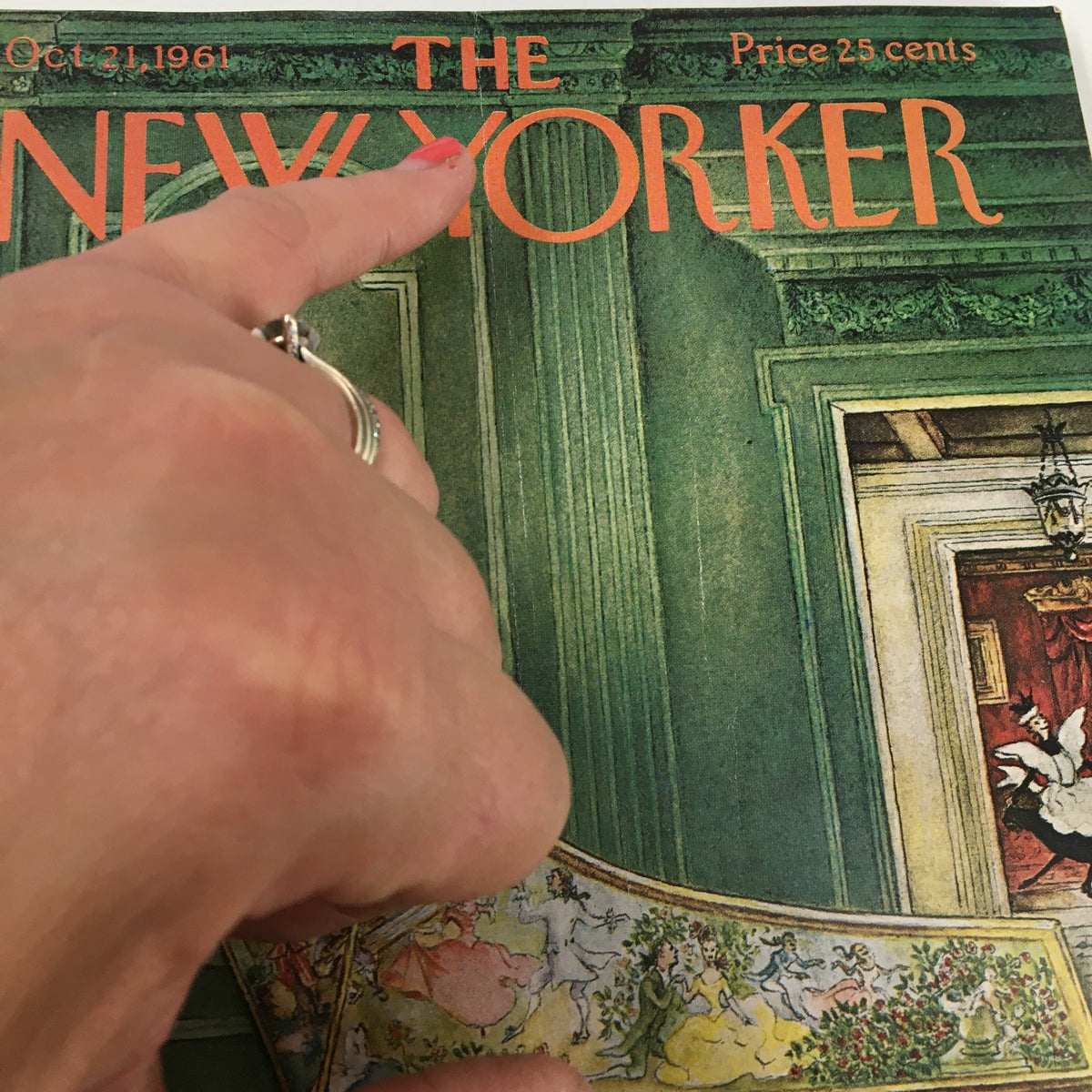 Close-up of the cover of The New Yorker magazine from October 21, 1961, showcasing the title with a hand pointing at 'THE NEW YORKER'.