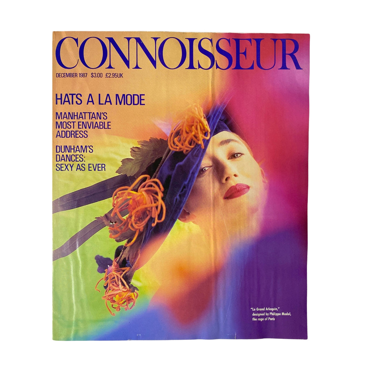 Connoisseur Magazine December 1987 cover featuring a vibrant photograph of a model with a stylish hat, headline 'Hats A La Mode', showcasing high fashion and culture.