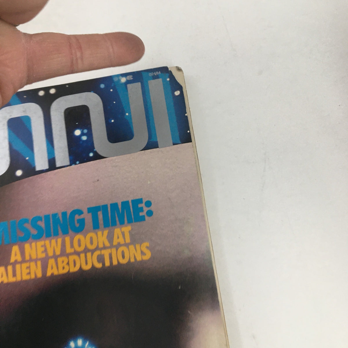 Detail view of the top corner of Omni Magazine December 1987 showing the title 'Missing Time: A New Look at Alien Abductions' and the magazine's logo.