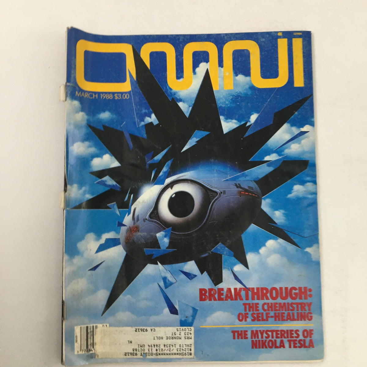 Cover of Omni Magazine March 1988 featuring the title 'Breakthrough: The Chemistry of Self-Healing' and 'The Mysteries of Nikola Tesla'. The cover showcases an abstract design with a central eye-like graphic set against a blue sky.