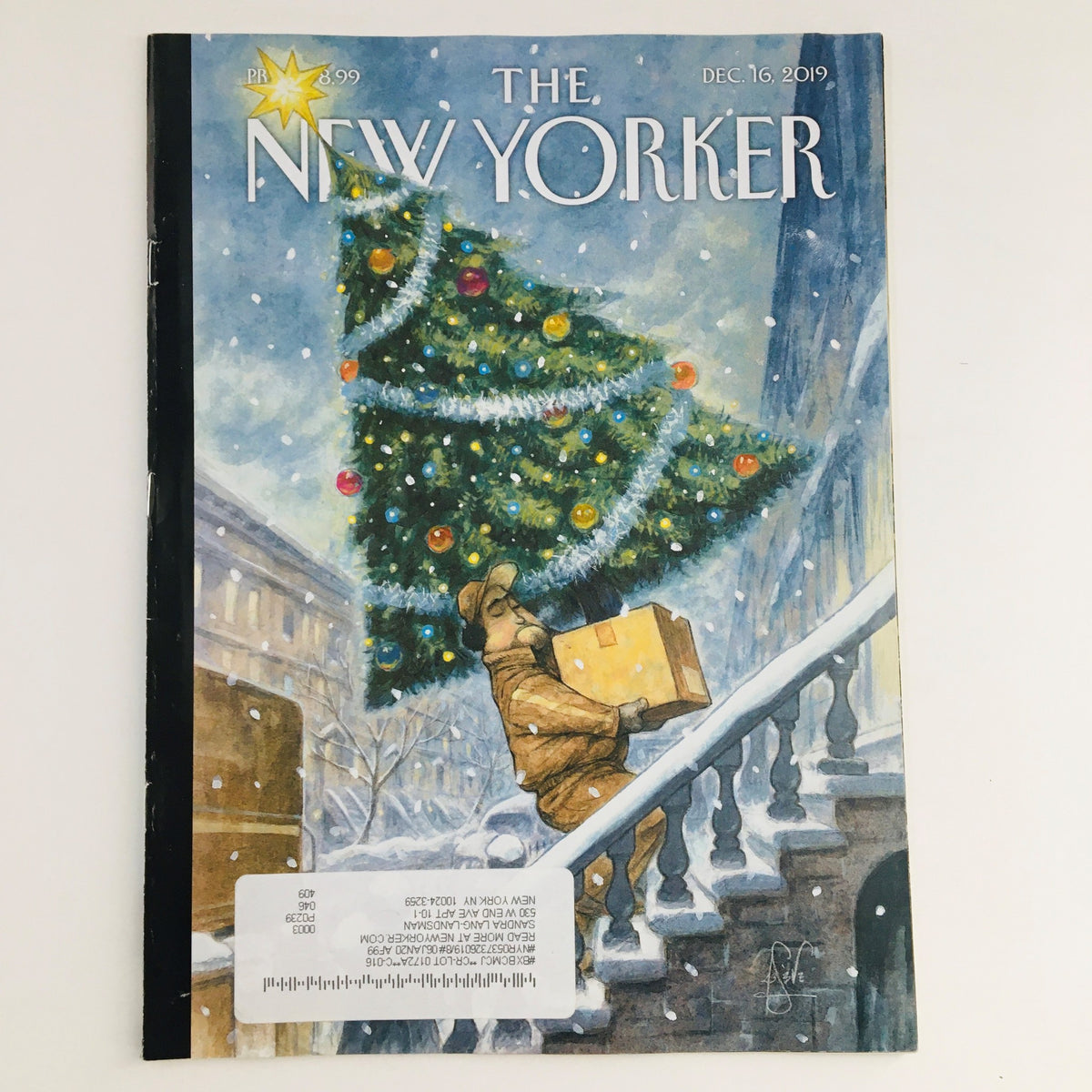 The New Yorker December 16 2019 Full Magazine Theme Cover by Peter de Sève featuring an illustration of a man carrying a package under a decorated Christmas tree, showcasing the magazine's artistic expression and cultural themes.